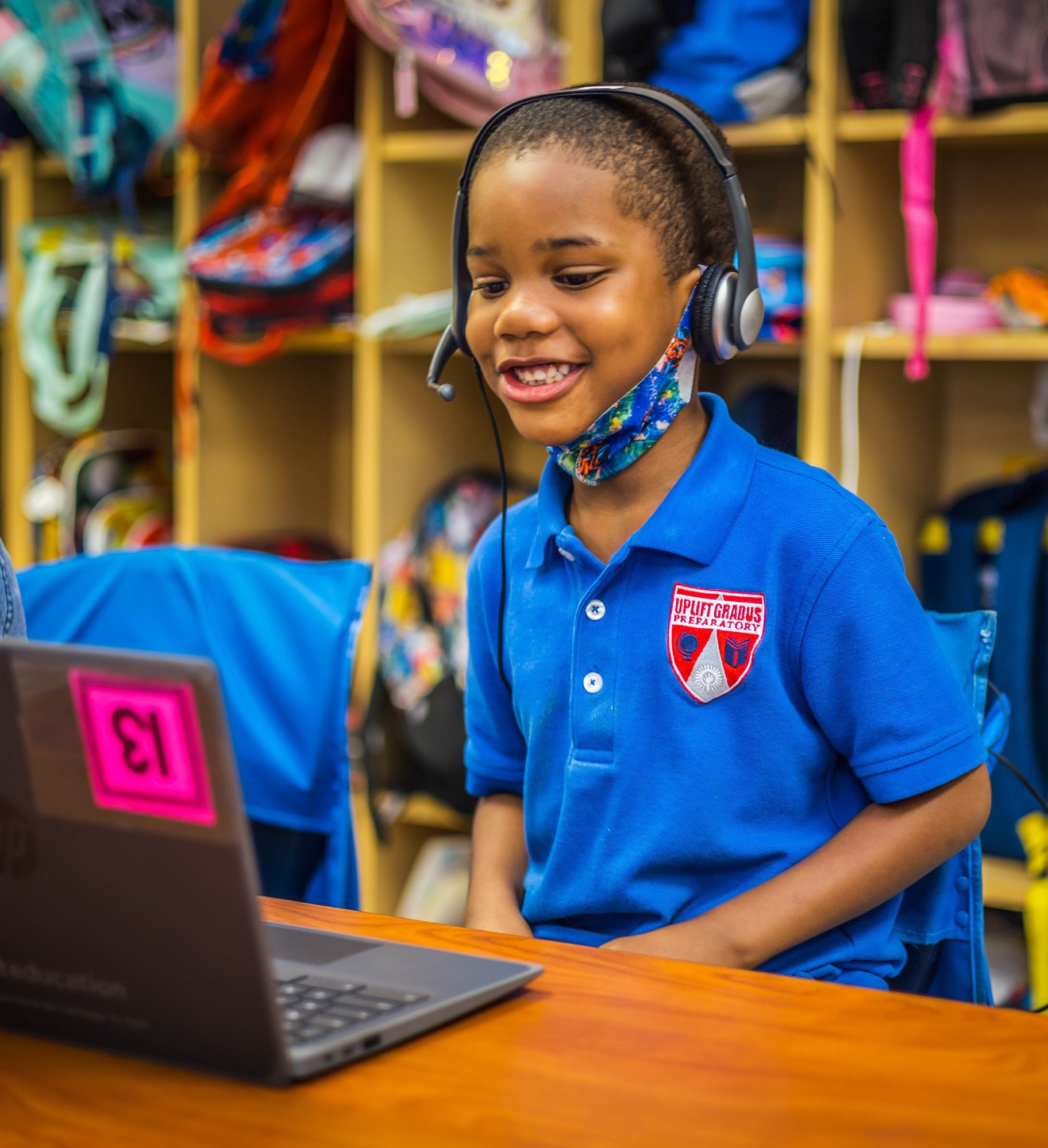 young child smiling at his virtual OnYourMark tutor young child smiling at his virtual OnYourMark tutor